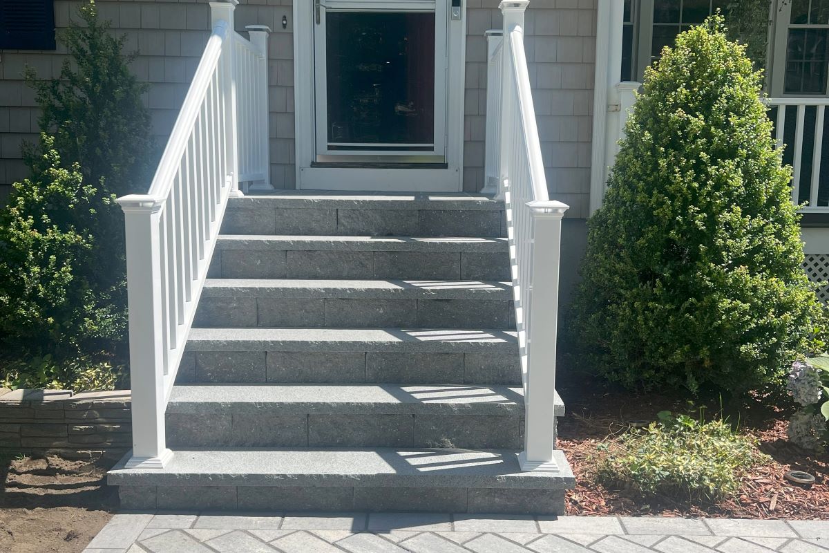 Tewksbury, MA Front Steps Entryway: Expert masonry and hardscape service in Tewksbury, Massachusetts, showcasing the expertly crafted front steps entryway. Elevate your home's curb appeal with our skilled craftsmanship.