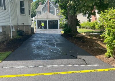Cambridge, MA Asphalt Driveway Installation: Professional hardscape and paving service in Cambridge, Massachusetts, showcasing expert asphalt driveway installation. Enhance your property with our skilled craftsmanship.