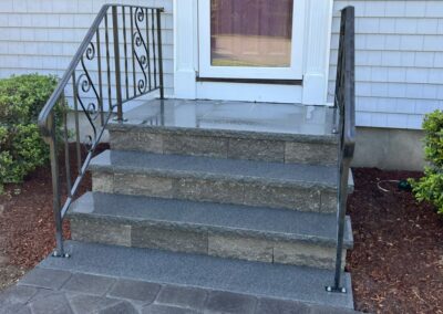Billerica, MA Front Steps Installation: Professional masonry and hardscape service in Billerica, MA, showcasing the expert installation of elegant front steps. Enhance your home's curb appeal with our skilled craftsmanship.
