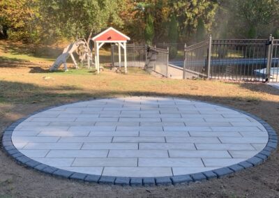 Expert Circular Patio Installation in Haverhill, MA: Elevate your outdoor living space with our professional hardscaping services. Our skilled team specializes in creating stunning and functional circular patios to enhance your property's beauty and functionality. Contact us today for a consultation!