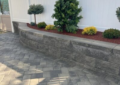 Arlington, MA Patio, Wall & Fence: Beautifully designed outdoor living space in Arlington, Massachusetts, featuring a custom patio, decorative wall, and stylish fence. Transform your backyard with our expert hardscape solutions.