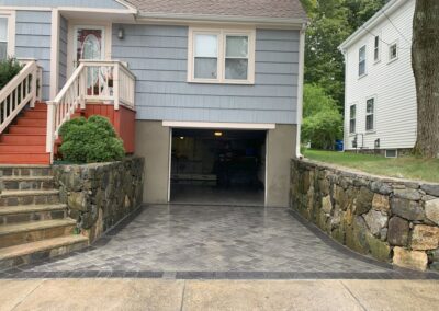Woburn, MA Paver Driveway: Professional hardscape and driveway installation service in Woburn, Massachusetts, featuring a beautifully designed paver driveway.