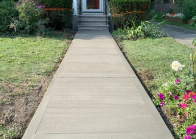 Completed concrete walkway installation in Newton, MA