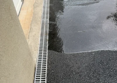 Driveway Drainage in Newton, MA: Channel Drain and Drywell Installation